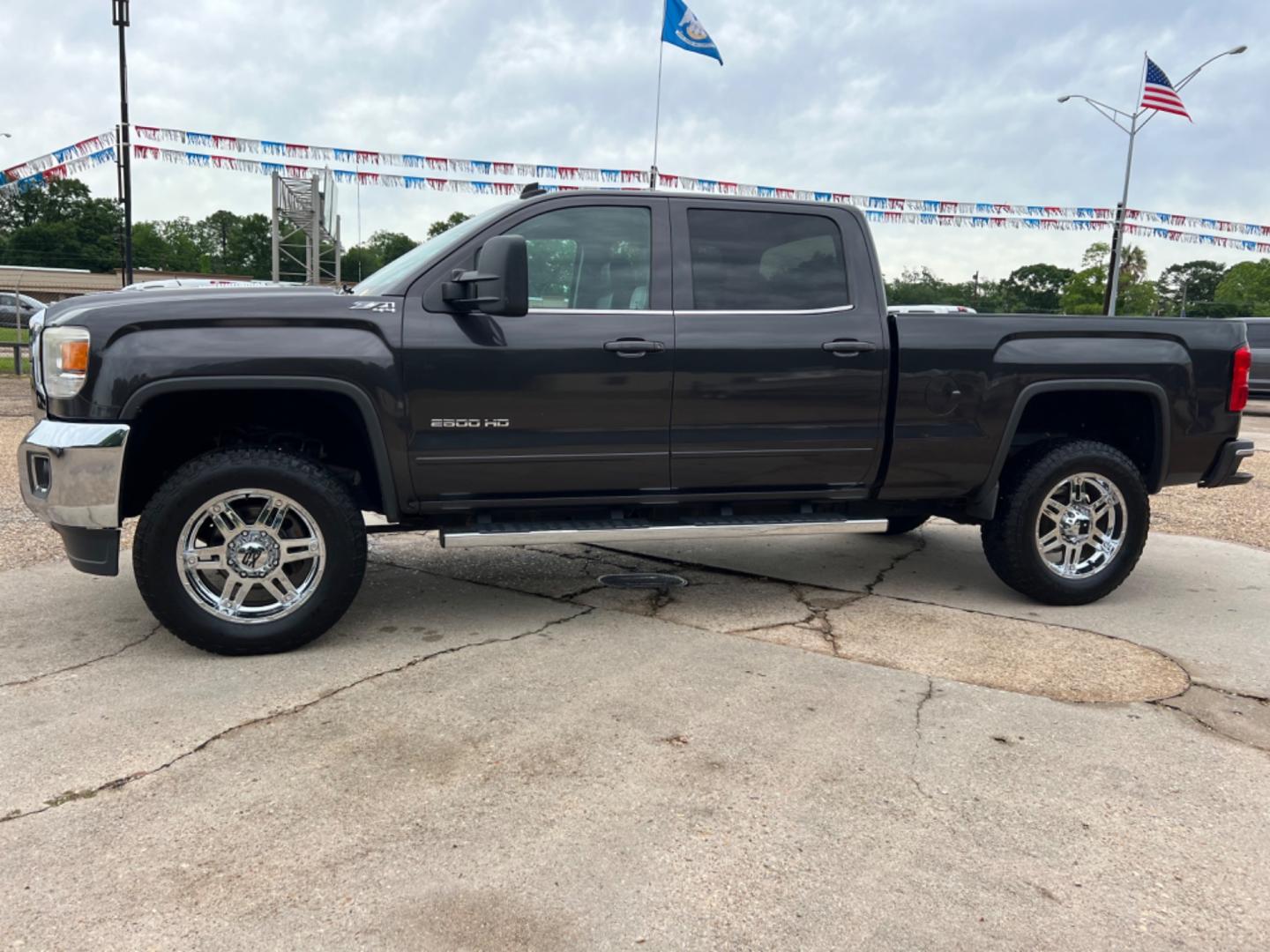 2015 Dark Grey /Black GMC Sierra 2500HD SLE (1GT12YE85FF) with an 6.6L Duramax Diesel engine, Allison Transmission transmission, located at 4520 Airline Hwy, Baton Rouge, LA, 70805, (225) 357-1497, 30.509325, -91.145432 - 2015 GMC 2500HD Crew Cab SLE 4X4 **No Accidents** 6.6L Duramax Diesel, Allison Transmission, Deleted, 200K Miles, Heated Leather, Power Windows, Locks & Mirrors, Cold A/C, Tow Pkg, Small Dent On Passenger Side Top Of Bed (See Pic). FOR INFO PLEASE CONTACT JEFF AT 225 357-1497 CHECK OUT OUR A+ RAT - Photo#1